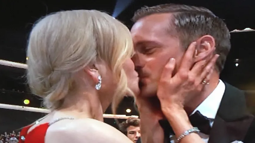 Kidman locks lips with Skarsgard, her husband claps away