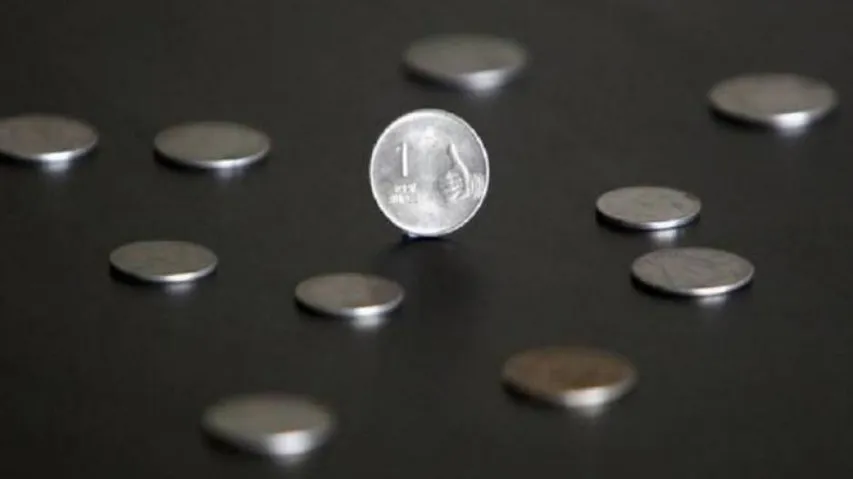 Rupee reverses gains to close nearly flat at 71.71 against US dollar