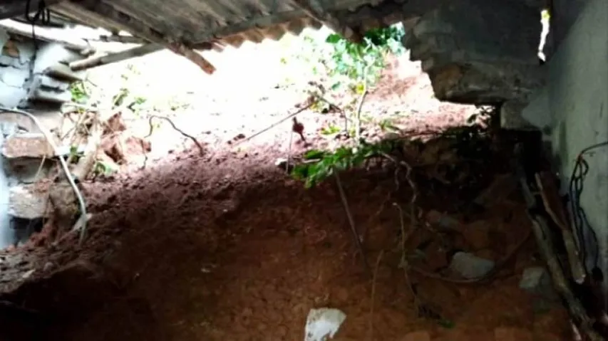 3 of a family critical as hill collapses on their house