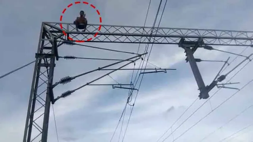 Man climbs atop electric tower at railway station; rescued