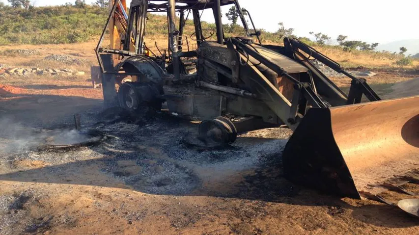 Maoists protest road work, set vehicles ablaze