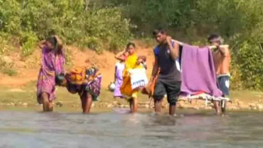 Sans motorable road, pregnant woman carried on cot!