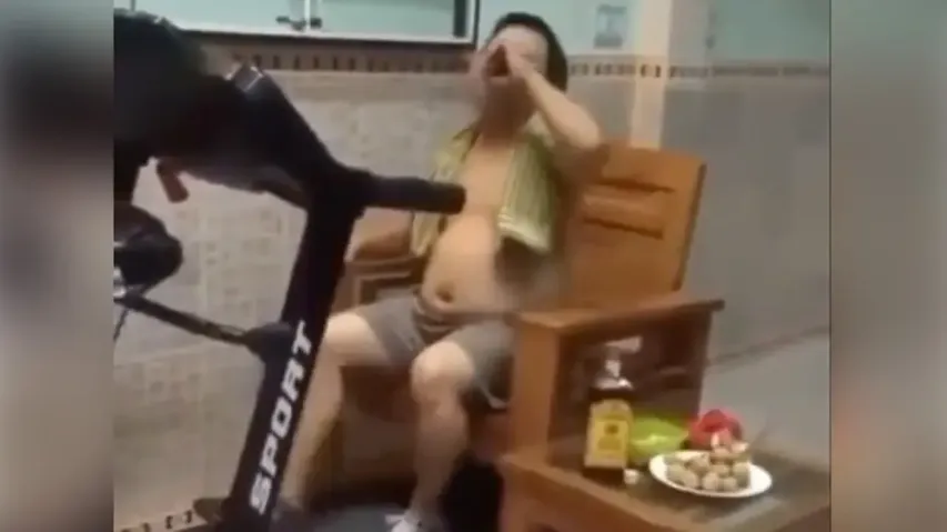 Laziest fitness freak ‘walks’ on treadmill while binging on alcohol & snacks; watch