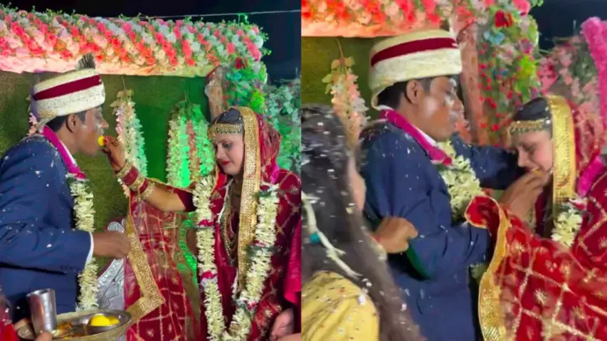 Groom force-feeds sweet to bride on wedding stage