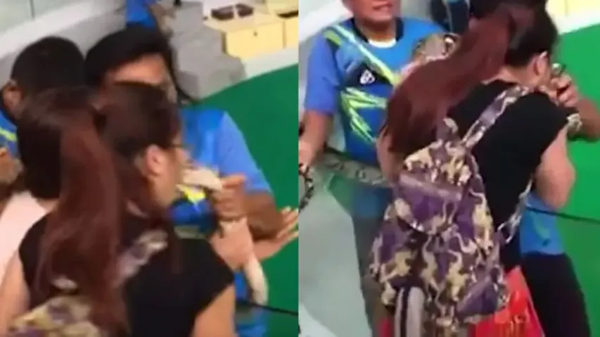 Snake bites woman as she tries to plant a kiss on its head