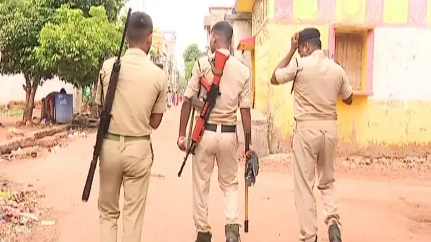 Police flag march after unrest at Padmakesharipur in Bhubaneswar