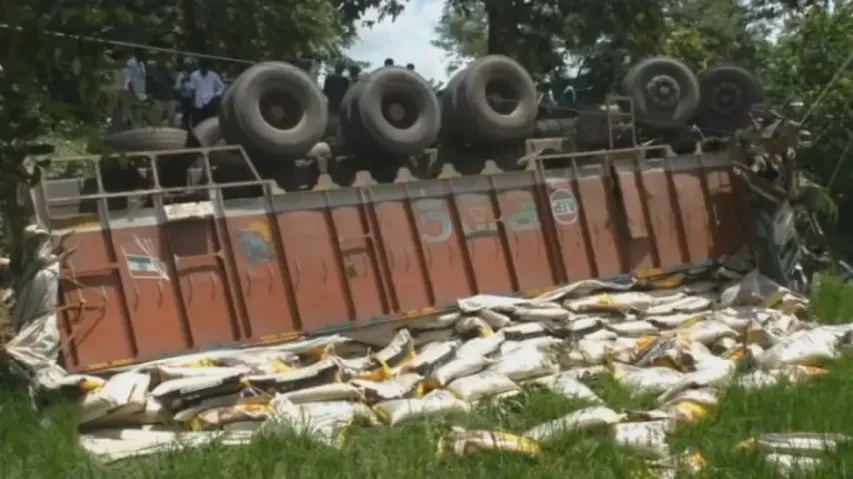 Driver narrowly escapes death as rice-laden truck overturns