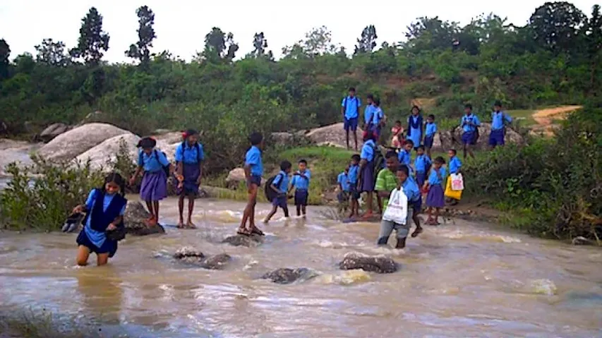 Children brave croc threat, waist-deep water to reach school