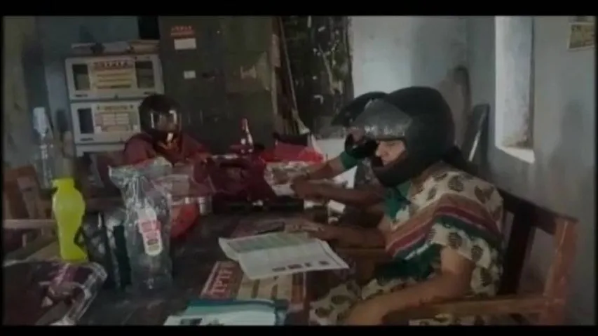 Teachers wear helmets to highlight poor state of school building
