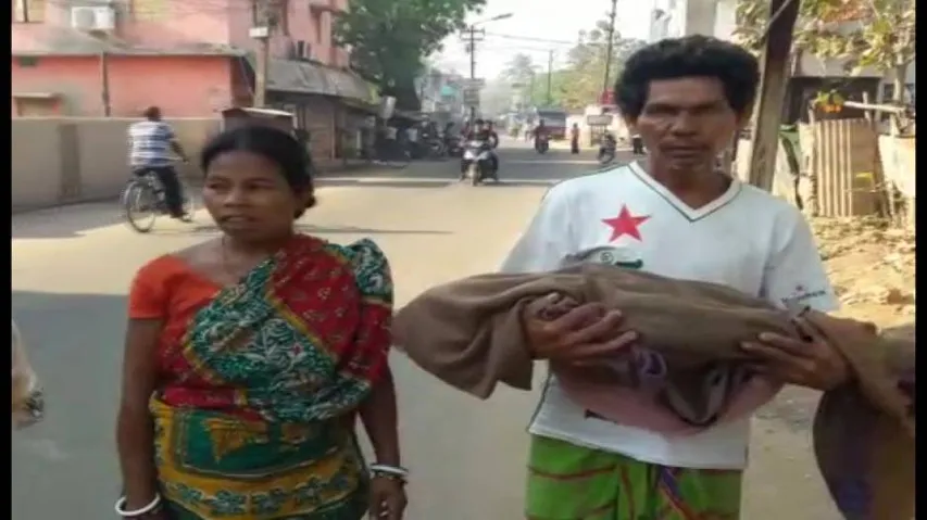 Denied hearse, father carries son's body in arms