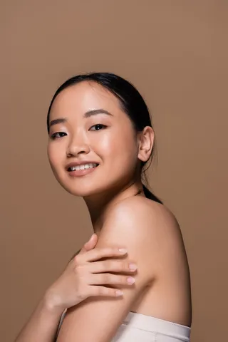 brunette-asian-woman-in-top-posing-and-looking-at-2024-11-10-12-19-59-utc (1)