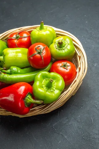 front-view-peppers-and-tomatoes-in-wicker-basket-b-2023-11-27-05-27-23-utc (1)