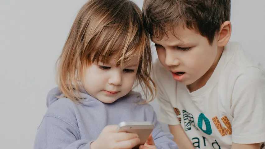 Children look phone