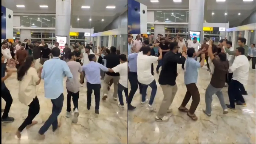 Passengers perform Garba at the airport