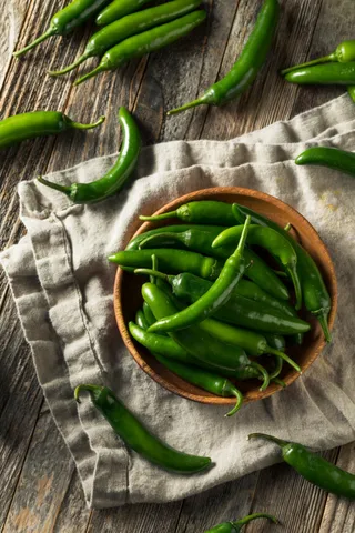 raw-green-organic-serrano-peppers-2023-11-27-05-00-12-utc (1)