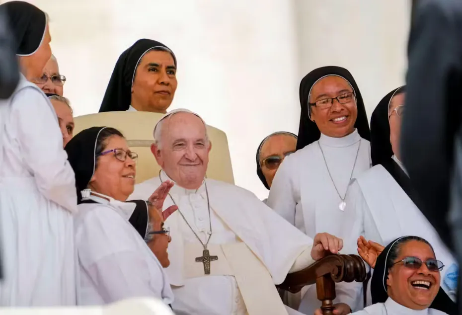 Pope Francis with a group of nuns in Vatican City. Alamy/AP/Andrew Medichini