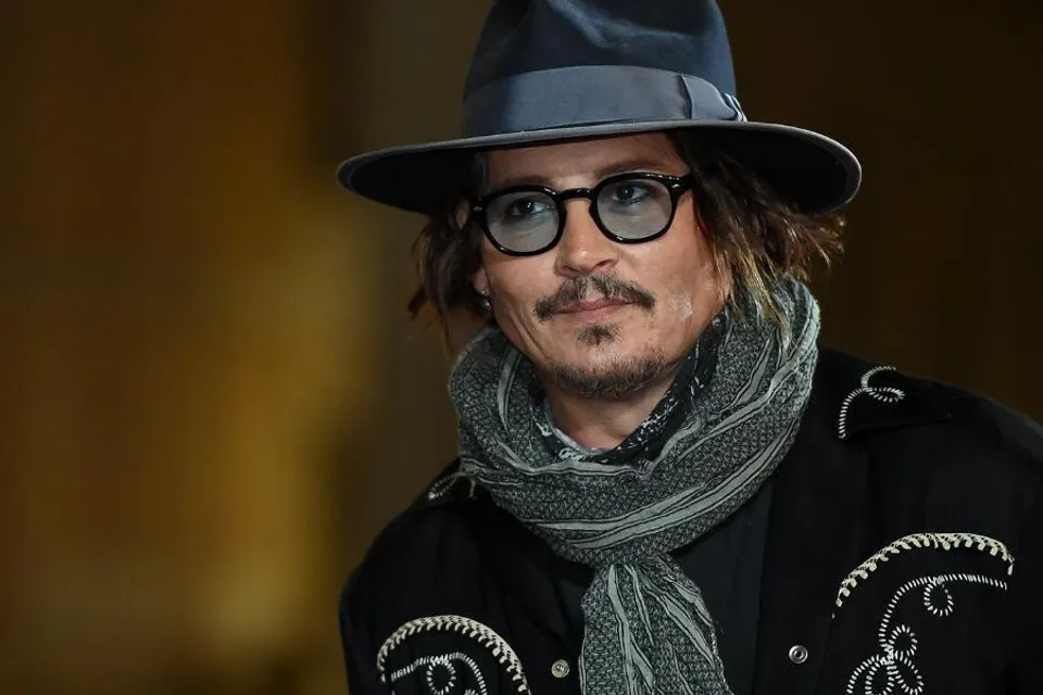 JOHNNY DEPP DONATES EARRINGS TO CHARITY ASSOCIATED WITH AMBER HEARD