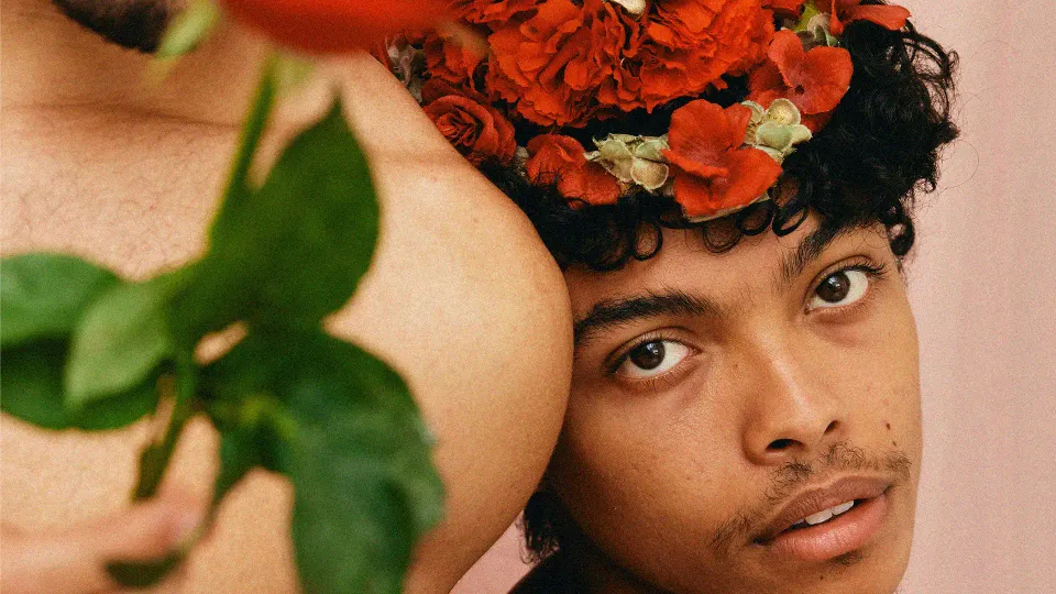 A person in a floral hairdo representing queer representation and gender expression in India