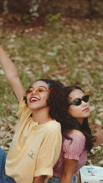Two friends enjoying an intimate picnic at the park