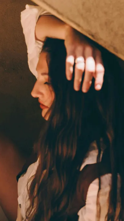 A side profile shot of a woman with her hair open