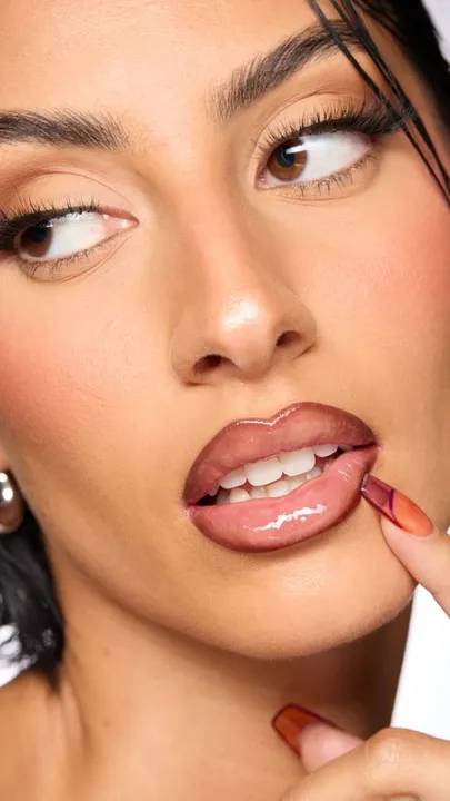 A zoomed-in shot of a woman's face with make-up and the best brown lip liner in India