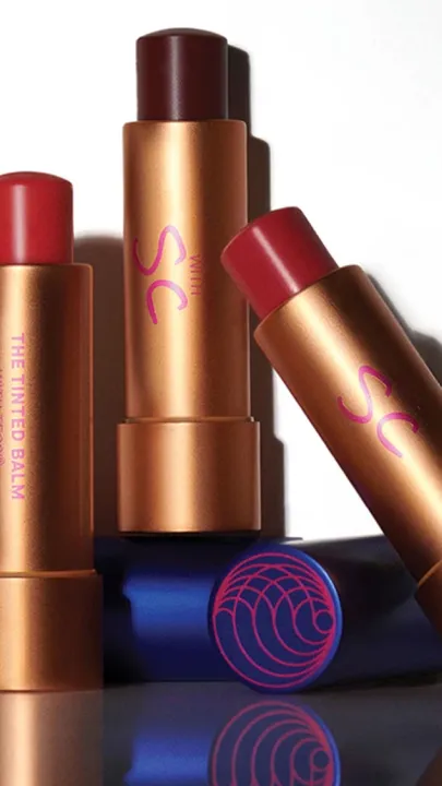 Four best lip balms with reddish tints placed next to each other