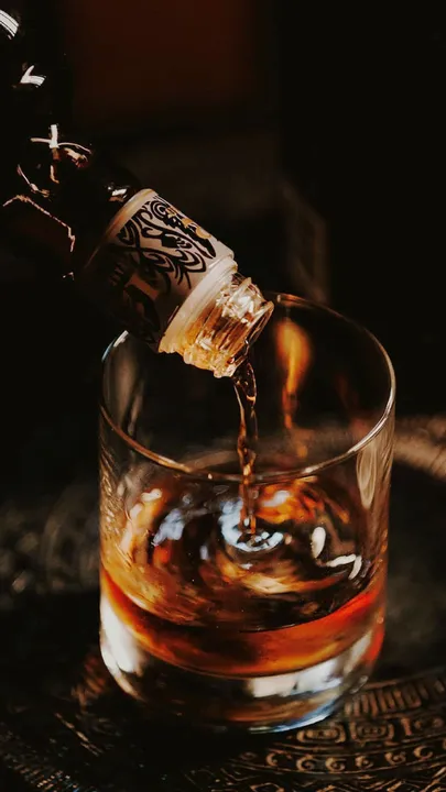 A picture of a drink being made using premium bitters brands to show how the usage of cocktail bitters in India has become common as bitter acquire luxury cocktail ingredients status with craft bitters India.