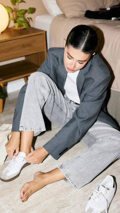 A woman wearing sneakers