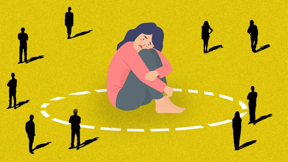 A woman sitting in a circle with multiple people outside against a yellow backdrop, reflecting the struggle with how to set boundaries in a relationship