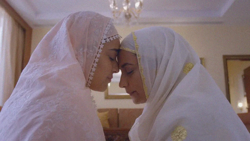 A still from a film with two women in white to depict how queer filmmakers in India and LGBTQ filmmakers India are making themselves visible in queer cinema India resulting in an increase n queer representation in Indian cinema