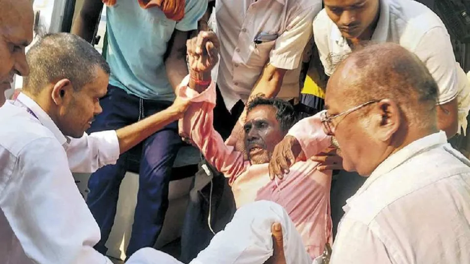 A man being taken to the hospital after he consumed suspected spurious liquor, in Siwan district, Thursday, Oct. 17, 2024.