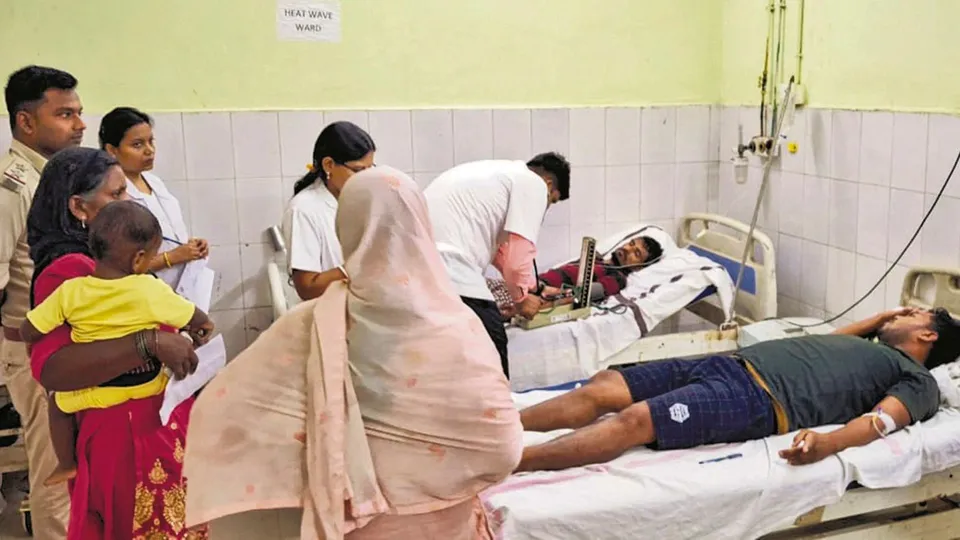 People being treated after the consumption of suspected spurious liquor, in Saran