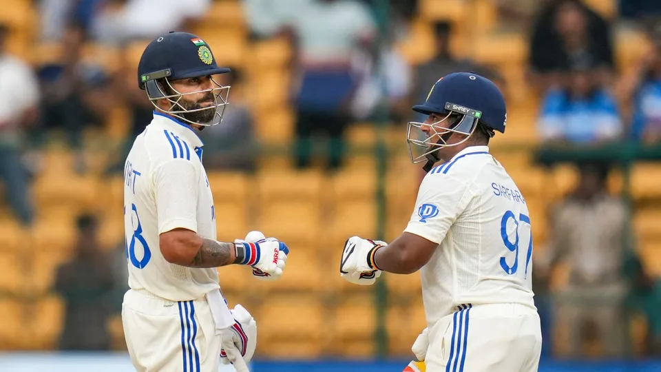 Virat Kohli and Sarfaraz Khan on the third day of the first test cricket match between India and New Zealand, at the M Chinnaswamy Stadium, in Bengaluru, Friday, Oct. 18, 2024.