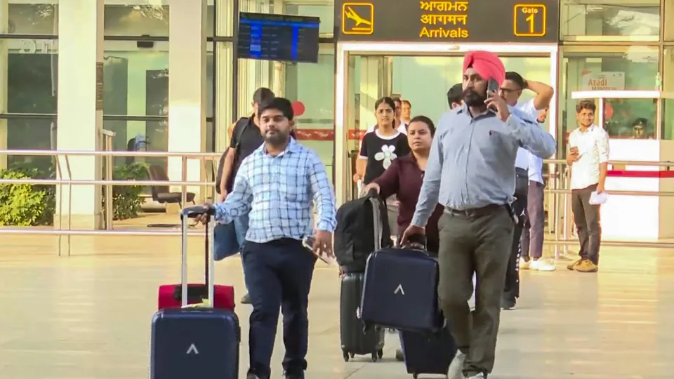 Passengers of the IndiGo flight that received a bomb threat come out of the Chandigarh airport, Saturday, Oct. 19, 2024.