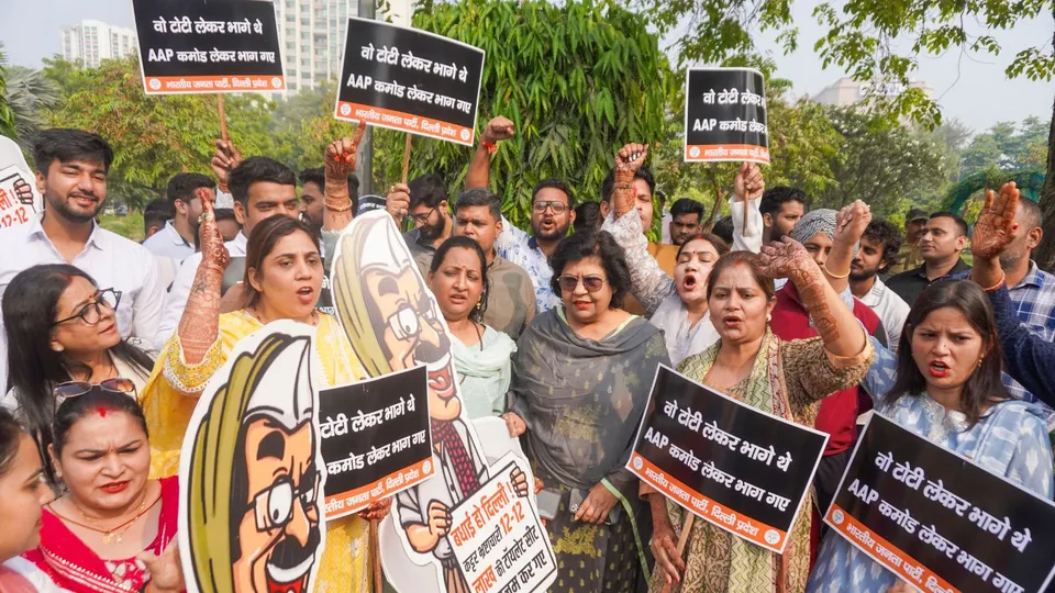 BJP workers stage a protest against former Delhi chief minister Arvind Kejriwal, in New Delhi, Tuesday, Oct. 22, 2024.