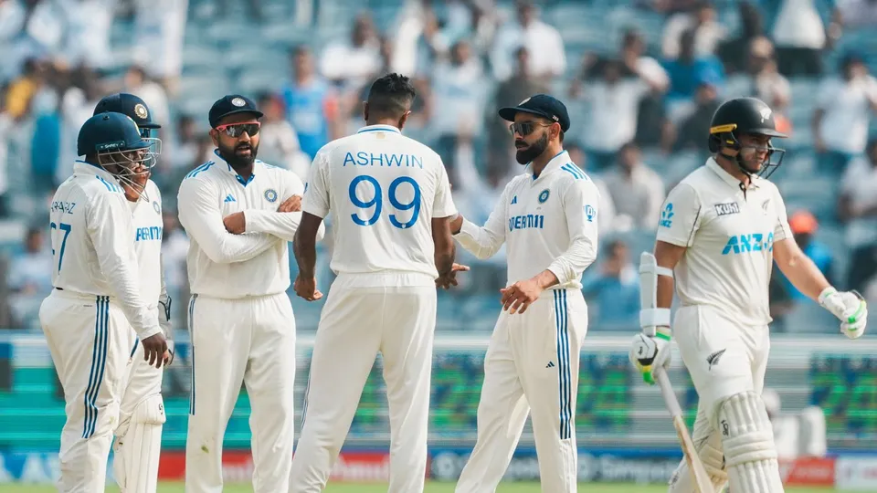 Ravichandran Ashwin celebrates with teammates after taking the wicket of New Zealand's captain Tom Latham, at the Maharashtra Cricket Association Stadium, in Pune, Thursday, Oct. 24, 2024.