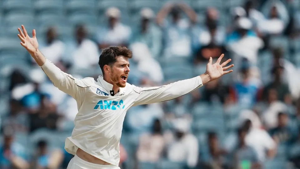Mitchell Santner celebrates the wicket of India's Ravichandran Ashwin, at the Maharashtra Cricket Association Stadium, in Pune, Friday, Oct. 25, 2024.