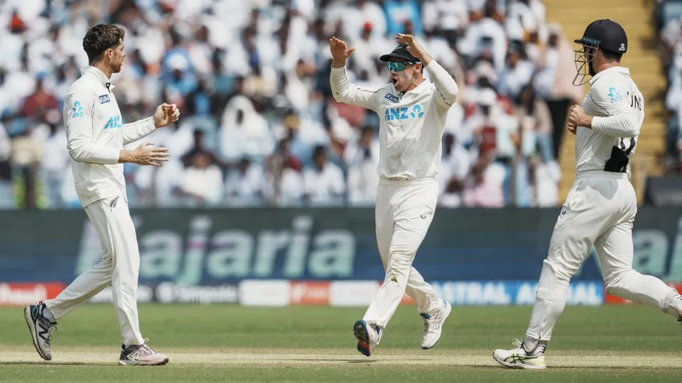 New Zealand's Mitchell Santner celebrates with captain Tom Latham and Will Young after taking the wicket of India's Yashasvi Jaiswal on the third day of the second test cricket match between India and New Zealand, at the Maharashtra Cricket Association Stadium, in Pune, Saturday, Oct. 26, 2024