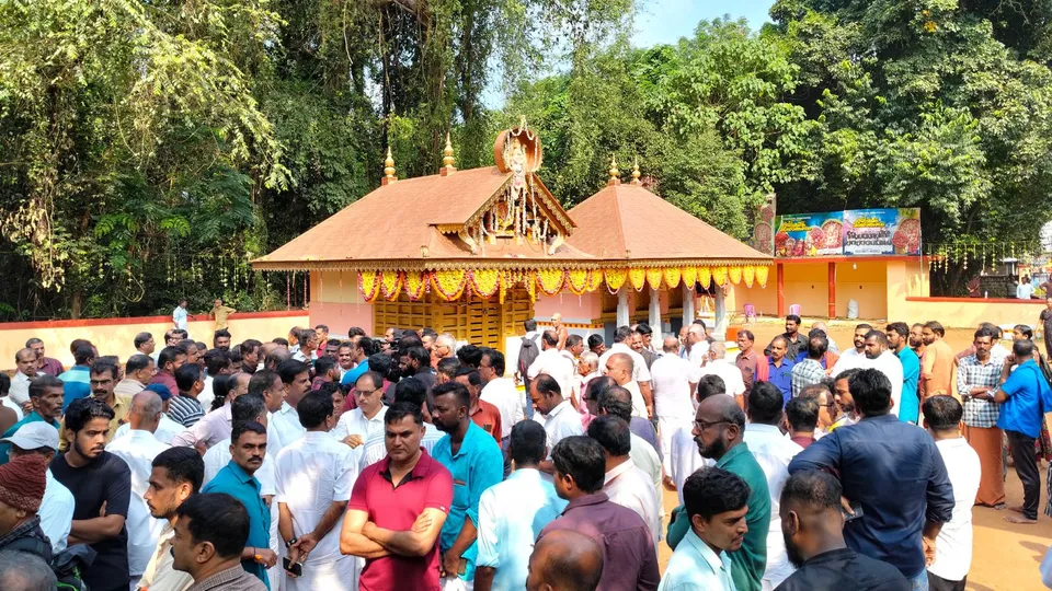 People gather at the fire accident spot at the Anjootambalam Veererkavu Temple at Neeleswaram in Kasaragod district, Tuesday, Oct. 29, 2024.