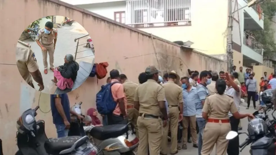 Telangana police and people outside the house of a visually challenged elderly couple who were found living with the body of their 30-year-old son on Tuesday