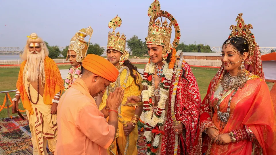 Uttar Pradesh Chief Minister Yogi Adityanath greets artists dressed as Lord Rama, Lord Lakshmana and Goddess Sita during Deepotsav 2024 celebration on the eve of the Diwali festival, in Ayodhya, Wednesday, Oct. 30, 2024