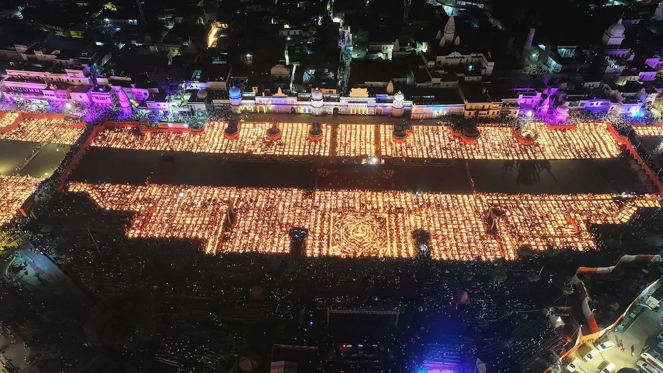 An aerial view of banks of the Saryu river illuminated with 'diyas' (earthen lamps) during 'Deepotsav 2024' celebration on the eve of the Diwali festival, in Ayodhya.