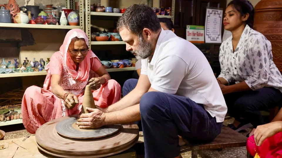 Leader of Opposition in Lok Sabha Rahul Gandhi tries his hand at pottery during a visit to a potter family amid the Diwali festivities.
