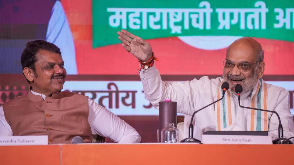Union Minister Amit Shah and Maharashtra Deputy Chief Minister Devendra Fadnavis during the release of BJP's manifesto for Maharashtra Assembly elections, in Mumbai, Sunday, Nov. 10, 2024.