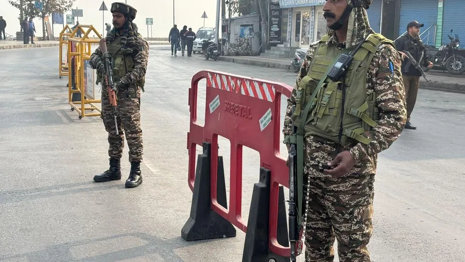 Security personnel stand on the road near the encounter site in Nehru Park area, Srinagar on November 10, 2024.