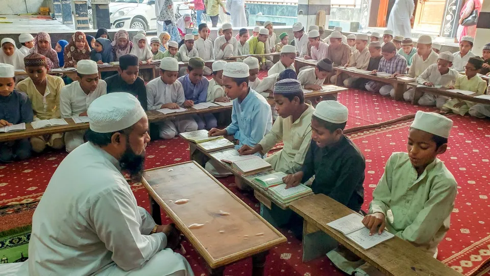 Children study at a Madrasa in Agra