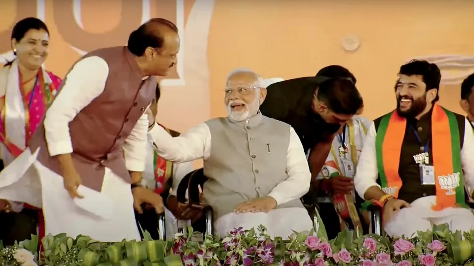 Prime Minister Narendra Modi with NCP leader Ajit Pawar during a public meeting ahead of Maharashtra Assembly elections, in Pune, Tuesday, Nov. 12, 2024.