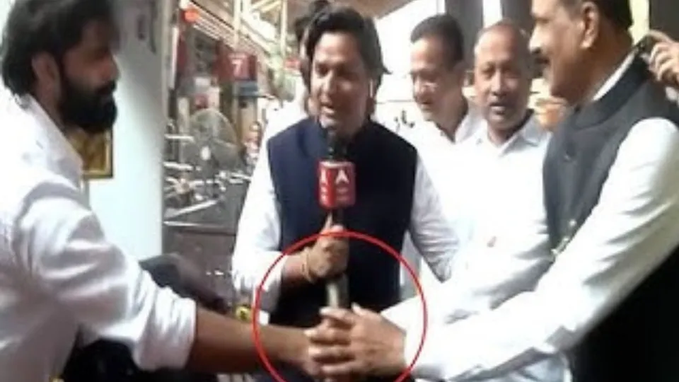 Rivals Amit Thackeray and Sada Sarvankar shake hands outside temple in Mumbai