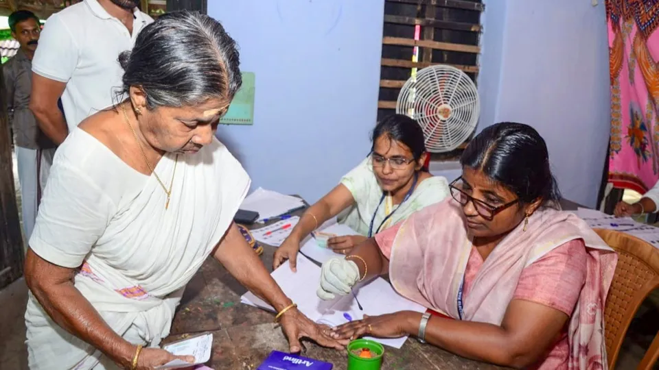 A voter gets her finger marked with indelible ink before casting vote during Kerala's Palakkad Assembly constituency bypoll, in Palakkad, Kerala, Wednesday, Nov. 20, 2024.