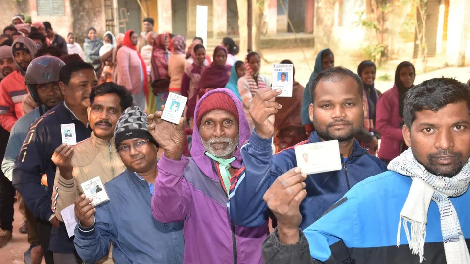 People stand in a queue to cast votes at a polling station during the final phase of Jharkhand Assembly Elections, in Ranchi district, Wednesday, Nov. 20, 2024